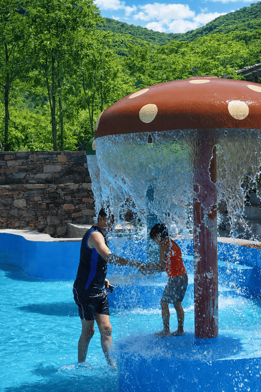 Children playing in splash pool